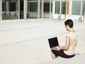 Businesswoman Using Laptop Outside Office Royalty Free Stock Photo