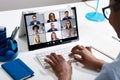 Woman Working From Home Having Group Videoconference