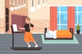 Businesswoman using laptop running on treadmill woman freelancer workout hard working concept modern bedroom interior