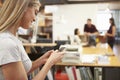 Businesswoman Using Mobile Phone In Modern Office Royalty Free Stock Photo