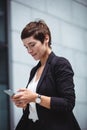 Businesswoman using mobile phone Royalty Free Stock Photo