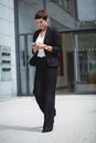 Businesswoman using mobile phone Royalty Free Stock Photo