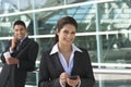 Businesswoman Using PDA Outside Office Royalty Free Stock Photo