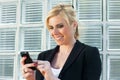 Businesswoman using smart phone Royalty Free Stock Photo