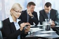 Businesswoman using smartphone in office Royalty Free Stock Photo