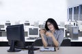 Businesswoman using a smartphone in the workplace Royalty Free Stock Photo