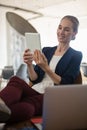 Businesswoman using tablet computer while sitting on chair Royalty Free Stock Photo