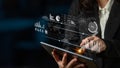 Businesswoman Using Tablet with Data Visualization Graphics and Analytics Interface for Modern Digital Technology and Royalty Free Stock Photo