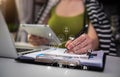 Businesswoman using tablet with laptop and document on desk in modern office . Royalty Free Stock Photo