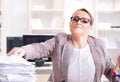 Businesswoman very busy with ongoing paperwork