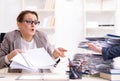 Businesswoman very busy with ongoing paperwork