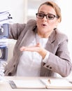 Businesswoman very busy with ongoing paperwork