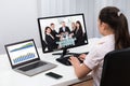 Businesswoman Videoconferencing On Computers Royalty Free Stock Photo