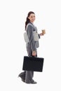 A businesswoman walking with a briefcase Royalty Free Stock Photo