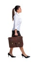 Businesswoman walking with a briefcase Royalty Free Stock Photo