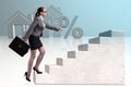 The businesswoman walking climbing stairs in mortgage Royalty Free Stock Photo