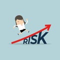 Businesswoman walking on grow up stock market graph above the word Risk.
