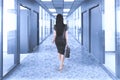 Businesswoman walking in the office corridor Royalty Free Stock Photo