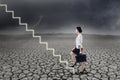 Businesswoman walking up on stairs Royalty Free Stock Photo