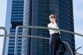 Businesswoman walks next to office building Royalty Free Stock Photo