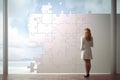 Businesswoman watching, big puzzle on wall, Woman looking at big puzzle, AI generated Royalty Free Stock Photo