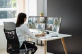 Businesswoman Watching CCTV Footage Of Office Interior Royalty Free Stock Photo