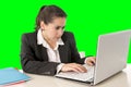 Businesswoman wearing business suit working on laptop computer green chroma key Royalty Free Stock Photo