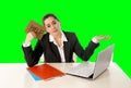 Businesswoman wearing business suit working on laptop computer green chroma key Royalty Free Stock Photo