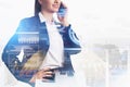 Businesswoman wearing formal suit is talking on smartphone Royalty Free Stock Photo