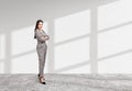 Businesswoman wearing formal wear is standing in crossed arms Royalty Free Stock Photo