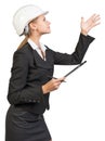 Businesswoman wearing hard hat, with clipboard and Royalty Free Stock Photo