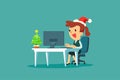 Businesswoman wearing santa claus hat while working with small christmas tree on her desk Royalty Free Stock Photo