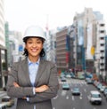 Businesswoman in white helmet with crossed arms Royalty Free Stock Photo