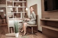 Businesswoman working in cozy spacious hotel room