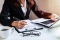 Businesswoman working on Desk office with computer and marketing graph statistics Royalty Free Stock Photo