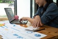 businesswoman working on desk office with using a calculator to calculate the numbers, finance accounting concept Royalty Free Stock Photo