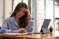 businesswoman working on desk office with using a calculator to calculate the numbers, finance accounting concept. Royalty Free Stock Photo