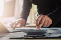 businesswoman working on desk using laptop for check data of finance