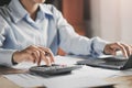 businesswoman working on desk using laptop for check data of finance