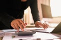 businesswoman working on desk using laptop for check data of finance in office