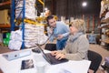 businesswoman working at desk in warehouse Royalty Free Stock Photo