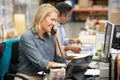 Businesswoman Working At Desk In Warehouse Royalty Free Stock Photo