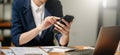 businesswoman working with digital tablet computer and smart phone with financial business strategy layer effect on desk in Royalty Free Stock Photo