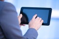 Businesswoman working on digital tablet outdoor over building background