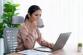 Businesswoman working and drinking coffee at her desk. Enthusiastic Royalty Free Stock Photo