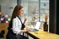 A businesswoman working on her business work in a coffee shop Royalty Free Stock Photo