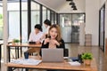 A businesswoman is working on her marketing project on her laptop at her desk Royalty Free Stock Photo