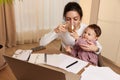 businesswoman working at home with her little child girl Royalty Free Stock Photo