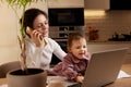 businesswoman working at home with her little child girl Royalty Free Stock Photo