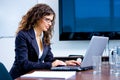 Businesswoman working on laptop